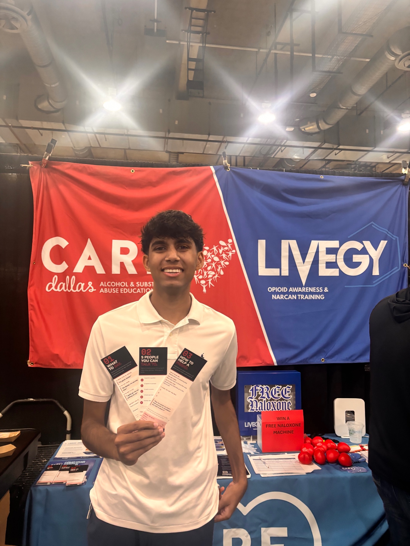 Rahul at the CARE Dallas and Livegy Narcan awareness booth