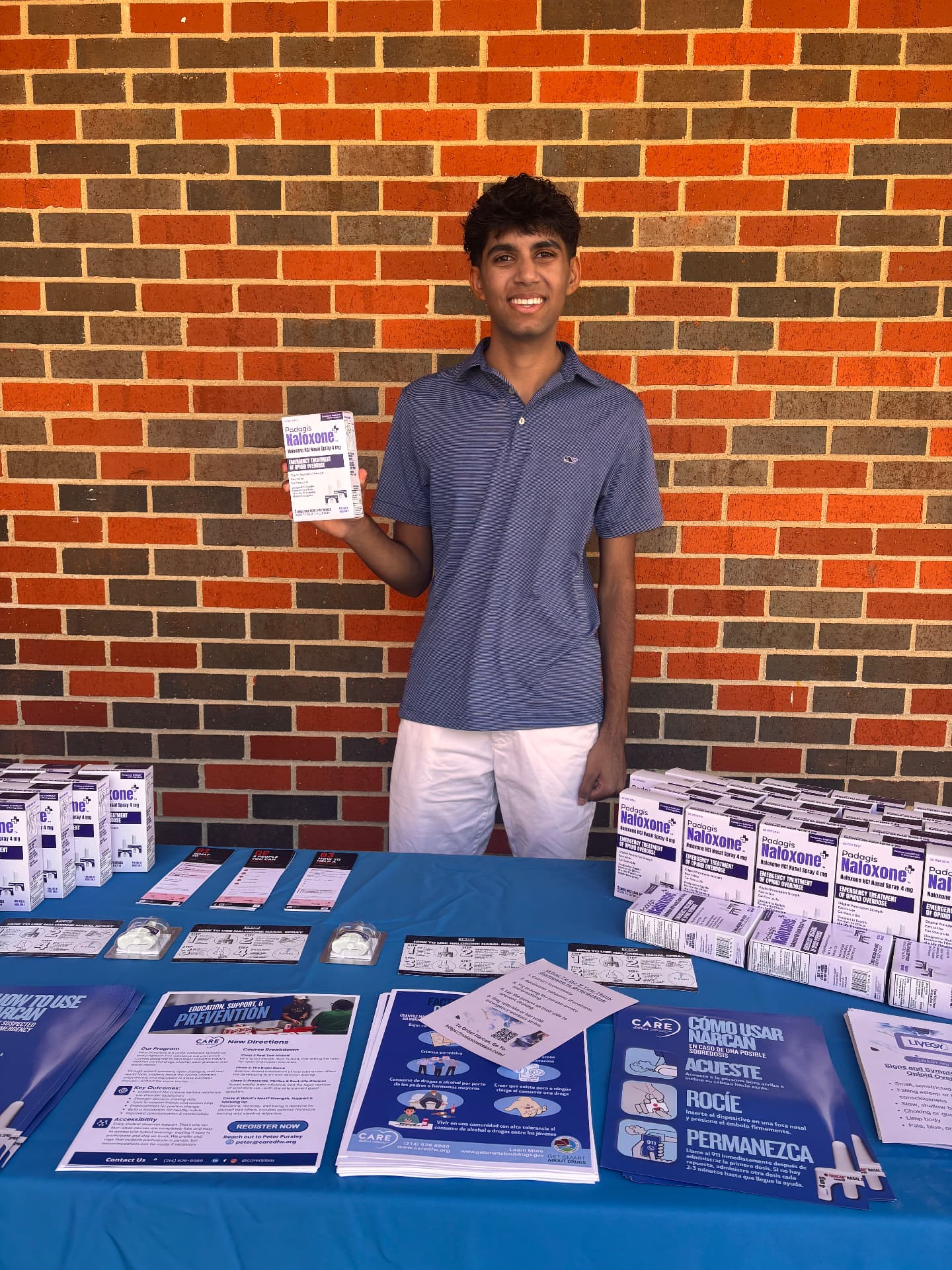 United Against Use volunteer with naloxone and prevention materials